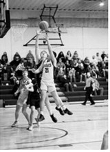 Brody Berg goes up strong in the paint scoring a bucket for the Eagles. Photo by Ashley Schafer