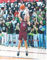 Maddux Stremick drops in one of his 3-three point baskets in the win over St John. Photo by Larry Stoke