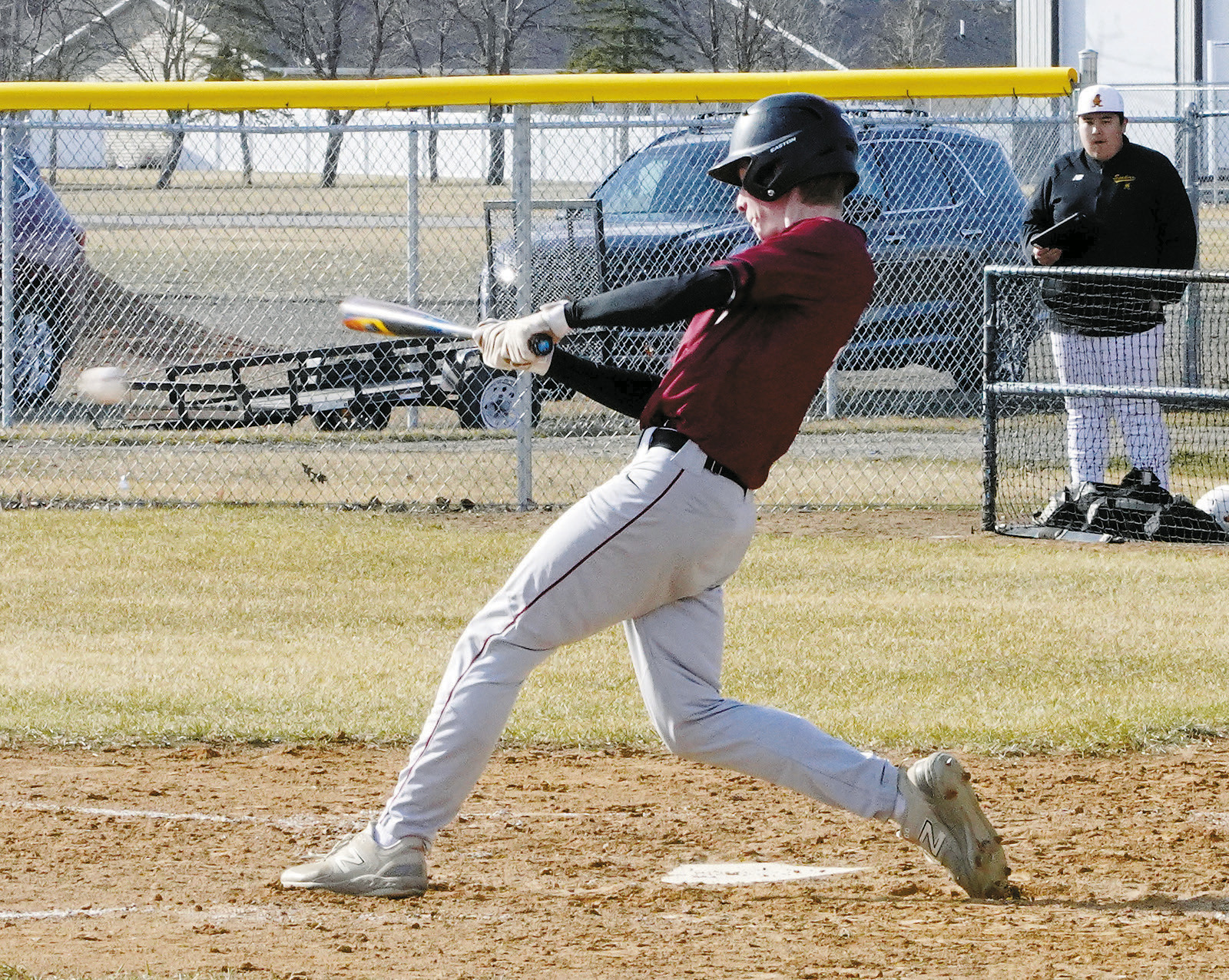Eastyn Schaefer connects for a base hit against the Grafton Spoilers. Photo by Larry Stokke.