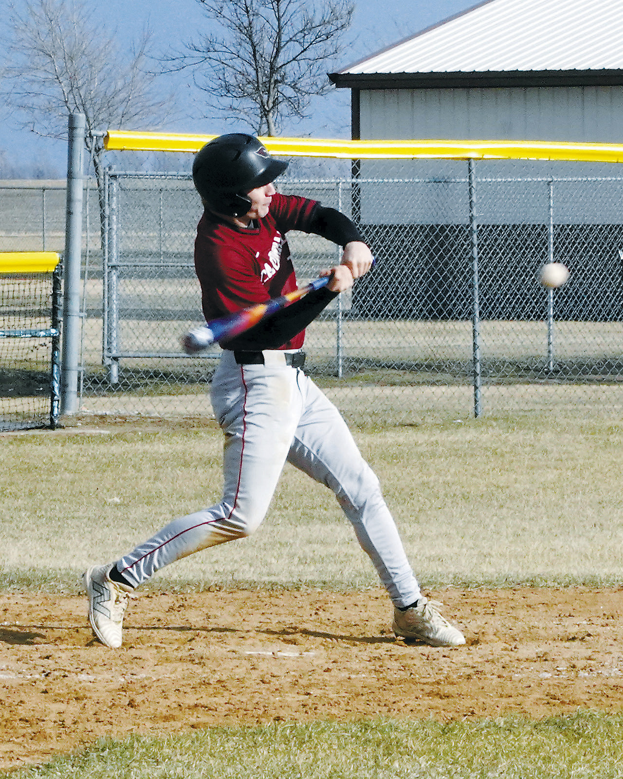 Grady Pankratz with a hit into the outfield for a base hit. Photo by Larry Stokke.