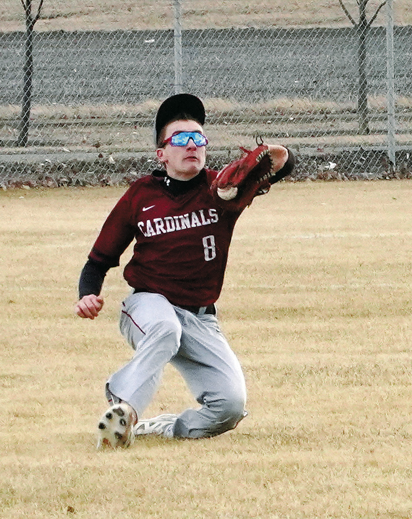 Eastyn Schaefer makes a catch in the outfield for an out against the Grafton Spoilers. Photo by Larry Stokke.