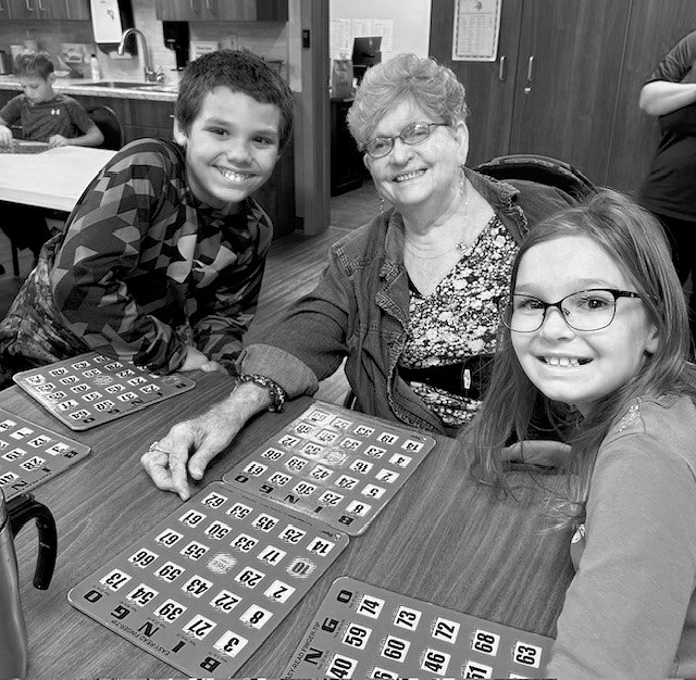 Zander, Bonnie, and Austyn visiting and playing bingo.