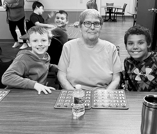 Brax, Lorraine, and Zander smile for a photo.
