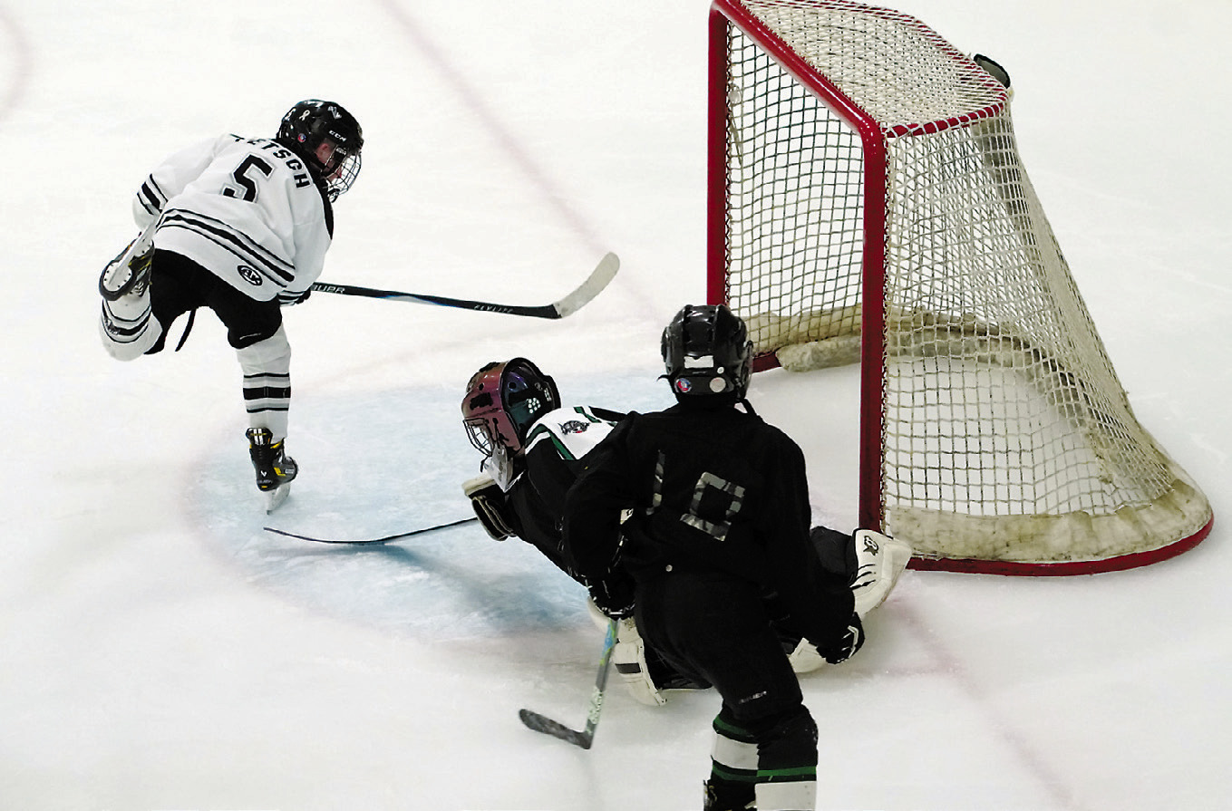 Cooper Fetsch scores on the Prowls to add to the Blades' 9-4 win over the JVC Prowl in Langdon on Nov. 29. Photo by Larry Stokke.