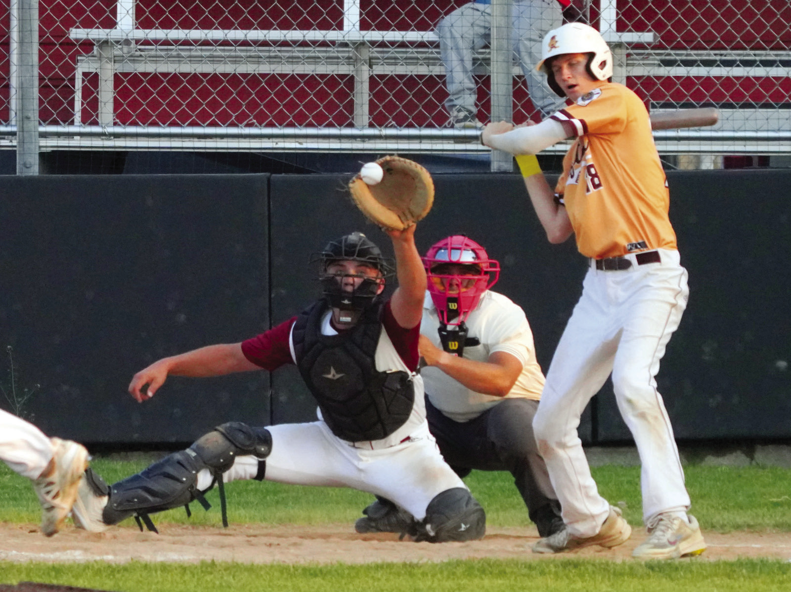 Landon Schneider eyes the ball with a catch behind the plate against Grafton in Langdon. PHOTO BY LARRY STOKE.
