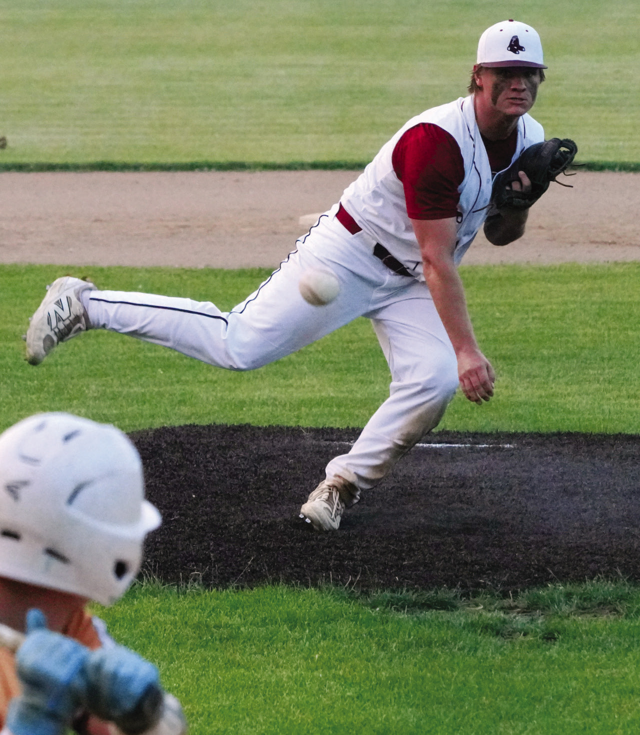 Player of the game for the Red Sox, Theo Romfo, fires a strike to the Grafton Player. PHOTO BY LARRY STOKE.
