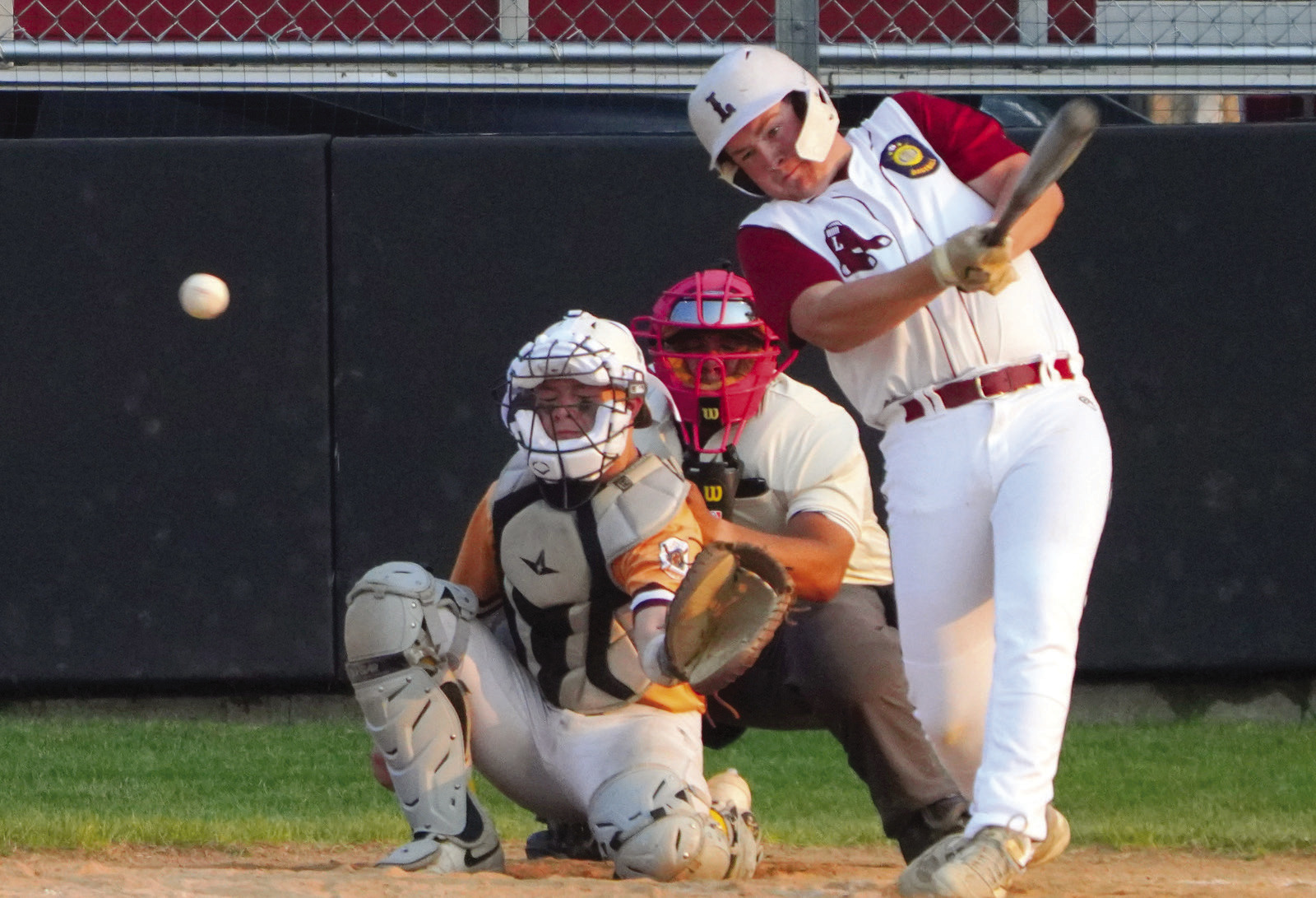 Devin Hakanson connects for a base hit against the Red Sox in Langdon on June 8. PHOTO BY LARRY STOKE.