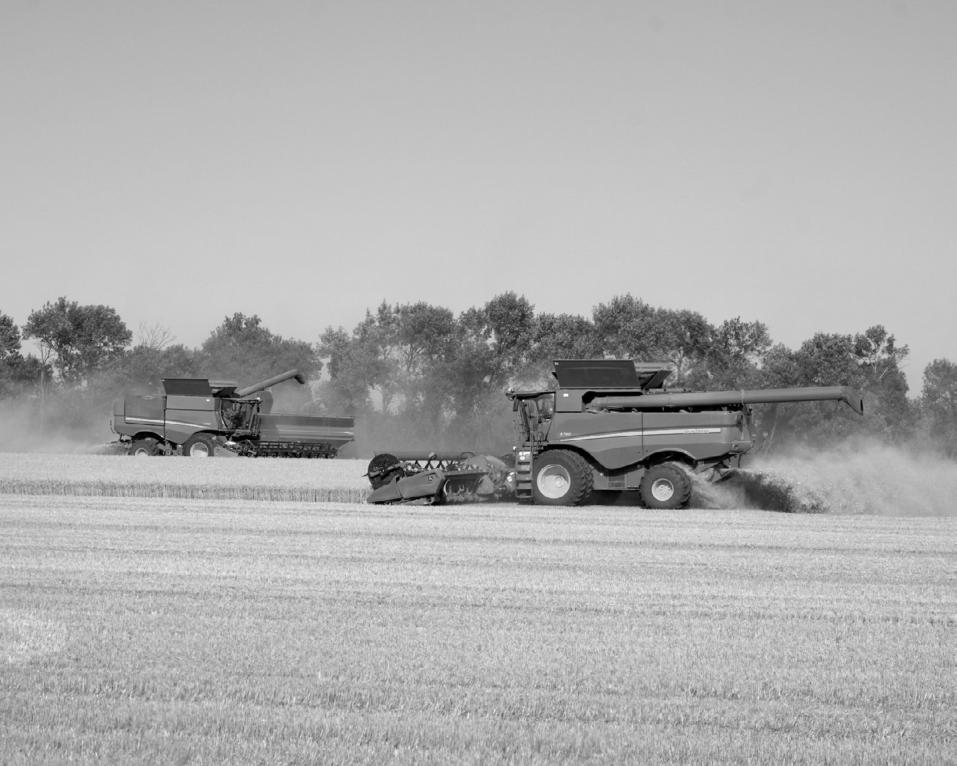 Combines working fields at the corner of Highway 5 and Highway 32 and harvest gets underway. Photo by Larry Stokke.