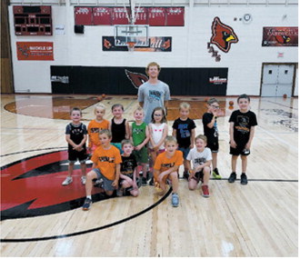 Participants in the Warwick Workouts basketball camp's K-2 session pose for a group photo during the June 8-10 camp in Langdon. The youngest camp group included 17 participants who spent three days learning basketball fundamentals and having fun on the court. Submitted photo