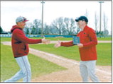 Langdon Area/Munich head baseball coach Josh Krivarchka accepts the Region 4 Coach of the Year award. Krivarchka was honored for his leadership and the Cardinals' successful season. Photo by Julie Davis