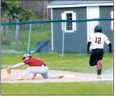 Devin Hakenson stretches to make the catch and records the out against Midway-Minto during North Border's regional tournament game in Langdon on May 20. Photo by Larry Stokke
