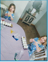Maisie &amp; McKenlee trying out a new method to dye their eggs. Submitted photo