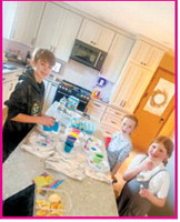 Terner, Wynn, and Kenzington creating colorful masterpieces in the kitchen. Submitted photo
