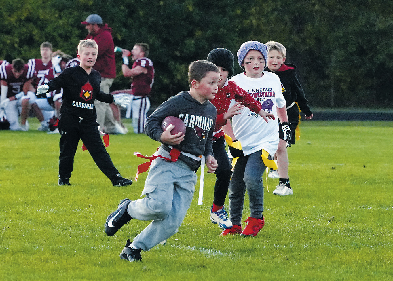 The future Cardinals football team entertaining fans at halftime. Photo by Larry Stokke.