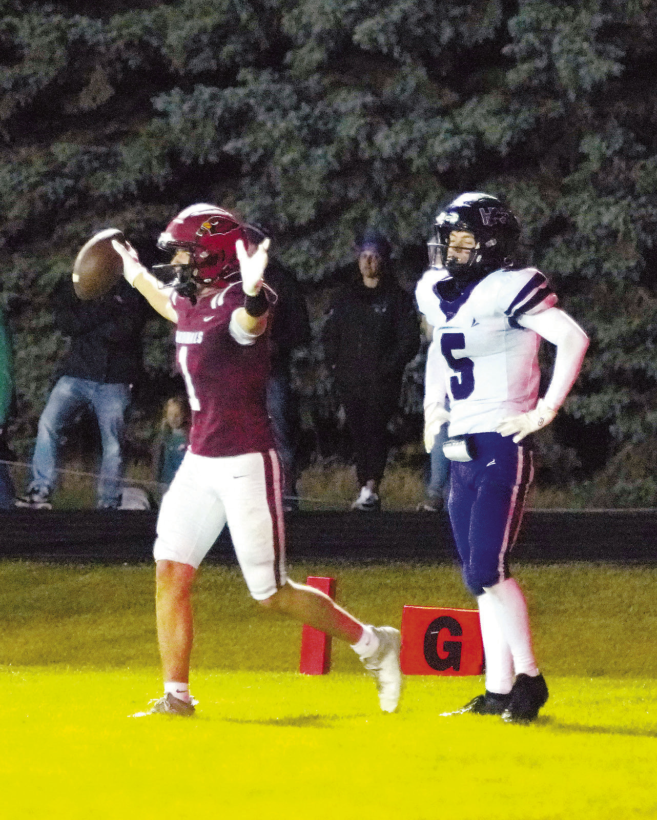 Eastyn Schaefer gets into the end zone to tack six more points onto the Cards' scoreboard. Photo by Larry Stokke.