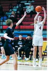 Levi Swanson drains a three-point bucket in the Cards win over the Thunder. Photo by Larry Stokke