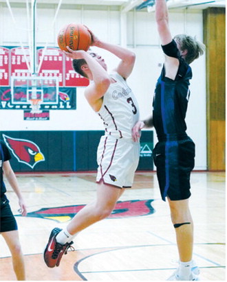 FM Bank Player of the Game Dawson Downs gets fouled sending him to the line where he dropped in two free throws. Photo by Larry Stokke.
