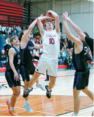 Maddux Stremick gets fouled, goes to the free throw line, and drops 2 in the hole. Photo by Larry Stokke.