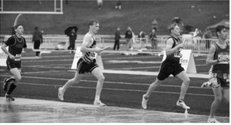 Owen Crosby runs a leg of the 4x800-meter relay for Pembina County North. The team of Owen Crosby, Micah Crosby, Ethan Kendell and Jaxon Suedel placed 12th with a time of 9:08.13 at the NDHSAA Class B State Track and Field Meet. Photo by Ashley Schafer
