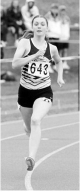 Shirley Kemp races to a personal-best time of 1:01.95 in the 400-meter dash at the NDHSAA Class B State Track and Field Meet. Photo by Larry Stokke