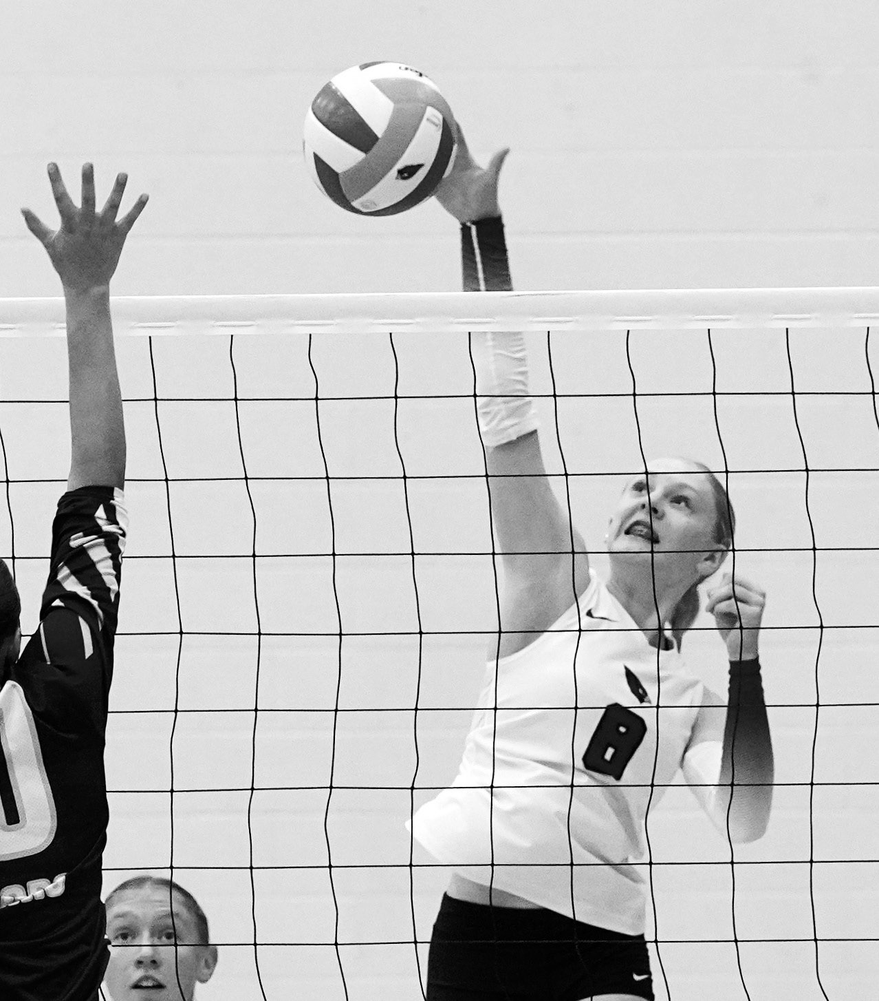 Hillary Haaven with one of her 11 kills to go along with 14 digs against the Cougars. Photo by Larry Stokke.