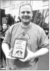 Pictured is Pembina County North head girls wrestling coach Crag Brodeur, receiving the 2026 East Region Girls Wrestling Coach of the Year award. Brodeur guided the Grizzly girls to the top seed in the East Region Dual Tournament, where they finished fourth. Crag is now up for the State Girls Wrestling Coach of the Year award. Congrats Coach Brodeur!