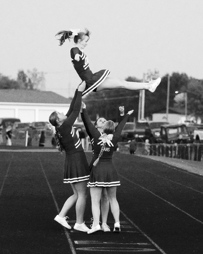 The Cardinals Cheer Squad keeping fans fired up. Photo by Larry Stokke.