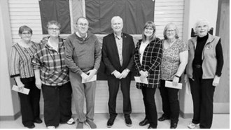 Accepting the grants from Curtis Olafson, president of the ICA, left to right, are Karen Kristjanson for the Thingvalla Cemetery Association, Michelle Murray for Svold Community Hall, Gerald Christianson for Borg Pioneer Memorial Home, Curtis Olafson - president of the ICA, Sharon Laxdal for the Gardar Town Lutheran Church, Karen Langerud for the Gardar Township Hall, and Carol Beard for Akra Hall at Icelandic State Park.