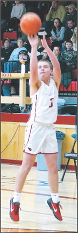 Dawson Downs drains a three-point basket against the Grafton Spoilers. Photo by Larry Stokke.