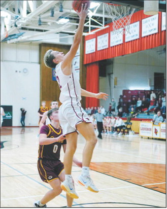FM Bank Player of the Game Tanner McDonald finger rolls in a lay-up in the game against the Grafton Spoilers Jan. 5 in Langdon. Photo by Larry Stokke.