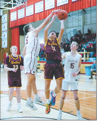 TJ Henderson gets a hand on the ball for a great blocked shot. Photo by Larry Stokke. FM Bank Player of the Game Tanner McDonald finger rolls in a lay-up in the game against the Grafton Spoilers Jan. 5 in Langdon. Photo by Larry Stokke.