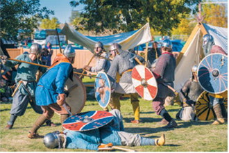 Armored warriors face each other in a battle demonstration at the Norsk Høstfest in Minot in 2024. Photo courtesy of Visit Minot/ND Tourism