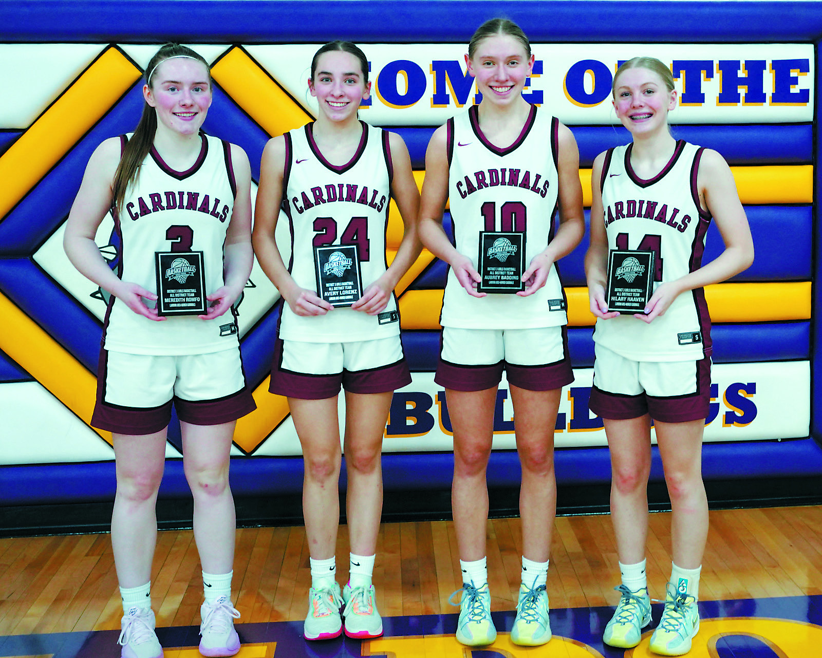 All District Team players (L-R) Meredith Romfo, Avery Lorenz, Aubrey Badding, and Hilary Haaven. Photo by Larry Stokke.