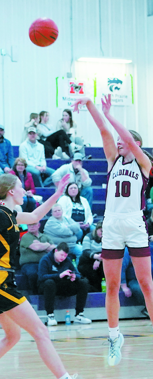 Aubrey Badding sinks one in the hole for 3 points in the District 3 Championship Game on Feb. 17. Photo by Larry Stokke.