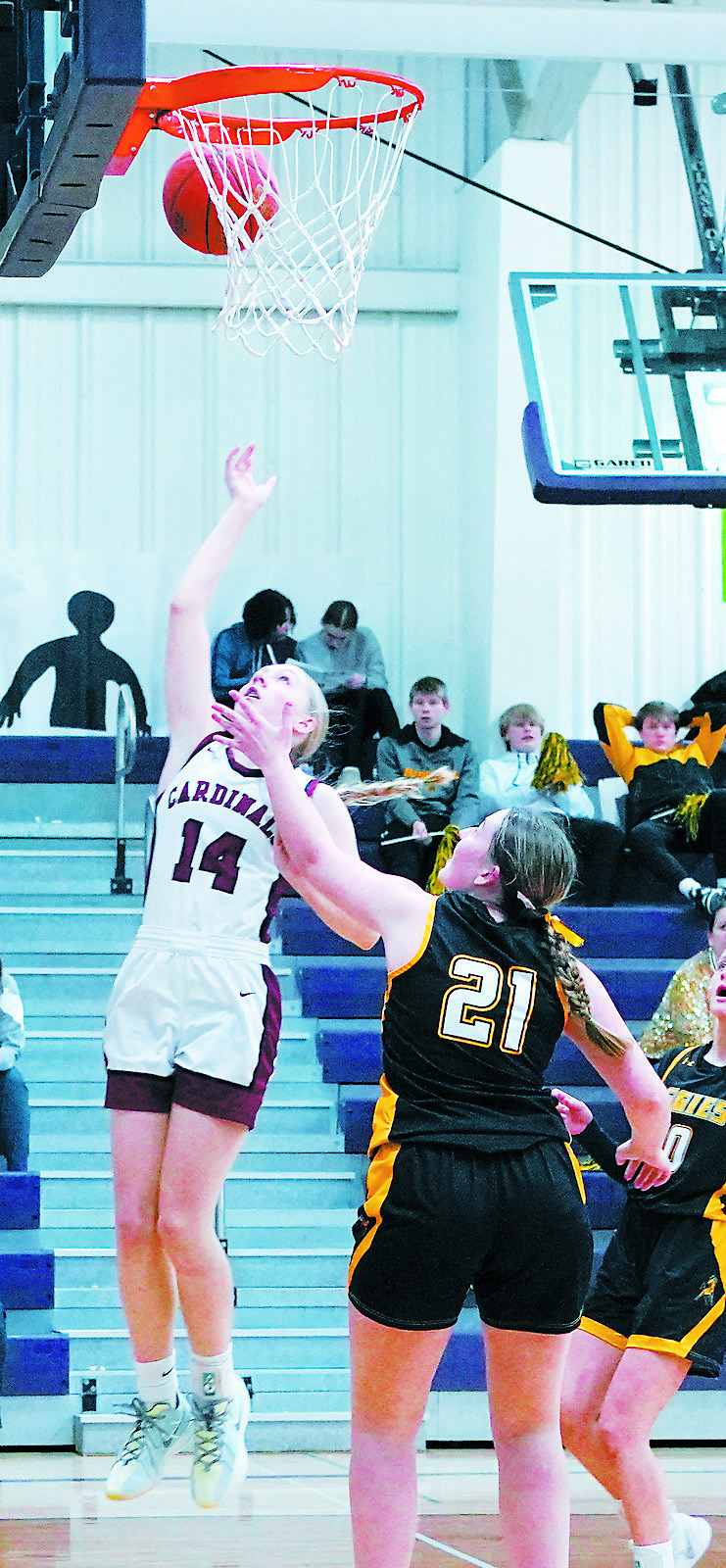 Hilary Haaven drives in the lane and adds 2 points to the Cards' score. Photo by Larry Stokke.