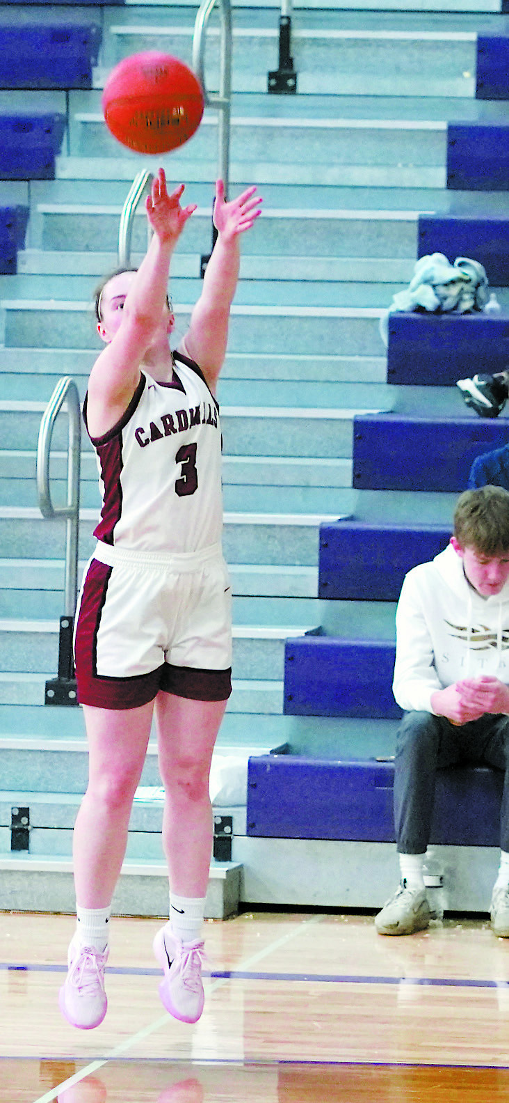 Meredith Romfo drains a 3-point shot and went seven for eight from the line, finishing with 24 points in the District 3 Championship game. Photo by Larry Stokke.