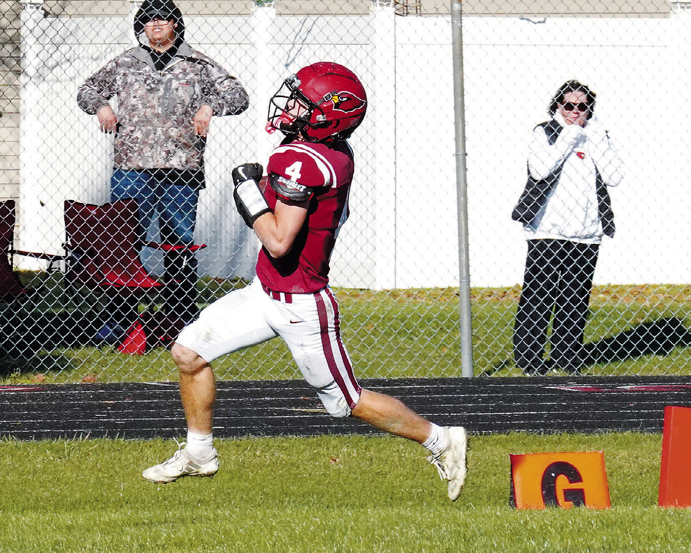 FM State Bank's Player of the Game Eastyn Schaefer crosses the goal line, scoring one of his two Sam Davis tacks on a touchdown in the Cards' win over Northern Cass. Photo by Larry Stokke. touchdowns. Photo by Larry Stokke.