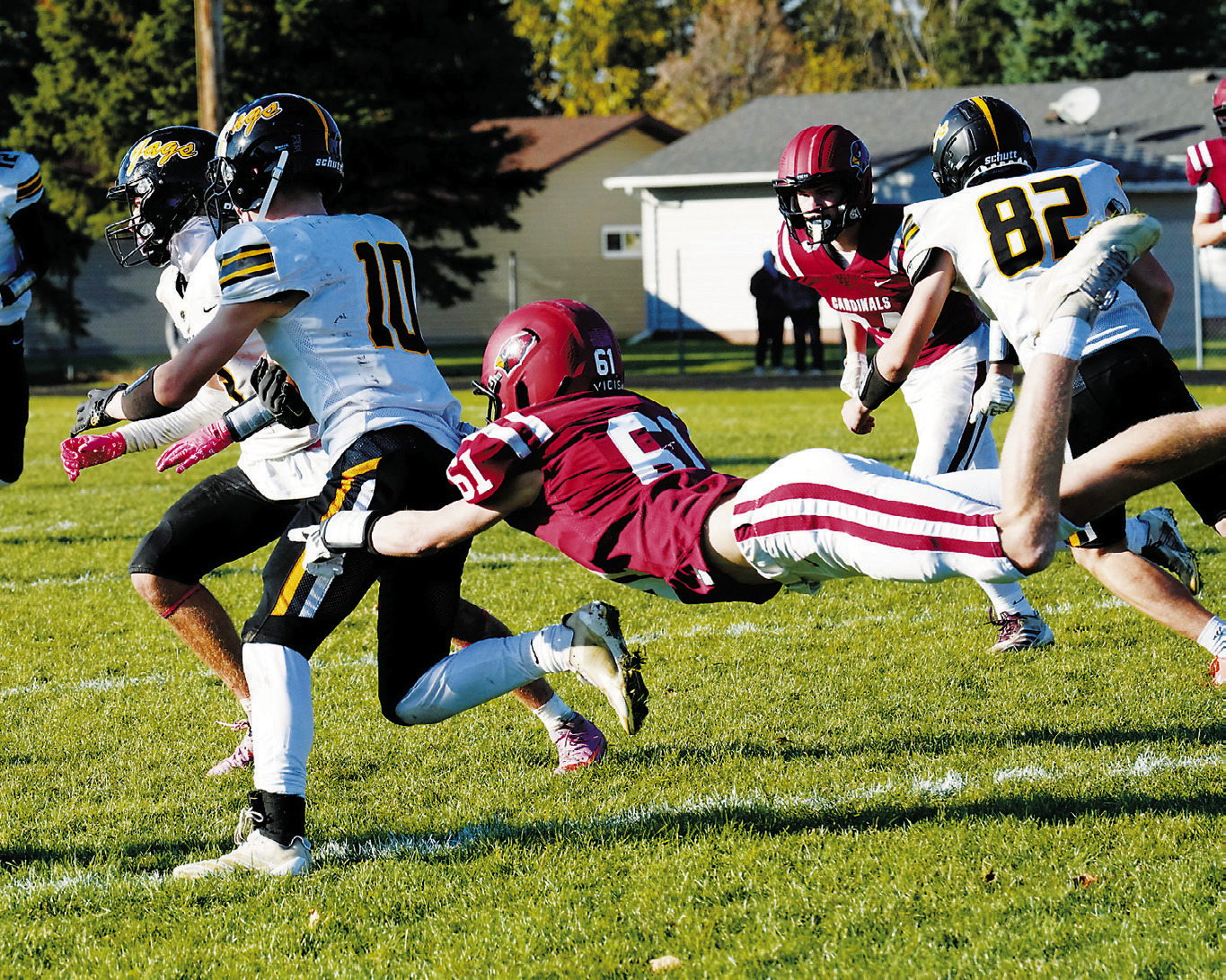 Caleb McDonald makes a diving tackle on a Jaguar receiver. Photo by Larry Stokke.