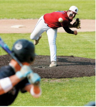 Devin Hakanson delivers a strike during Langdon's game against Midway-Minto on July 14. Photo by Larry Stokke