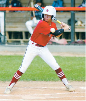 Bensen Fetsch takes a cut at the plate during Langdon's win over Midway-Minto on July 14. Photo by Larry Stokke
