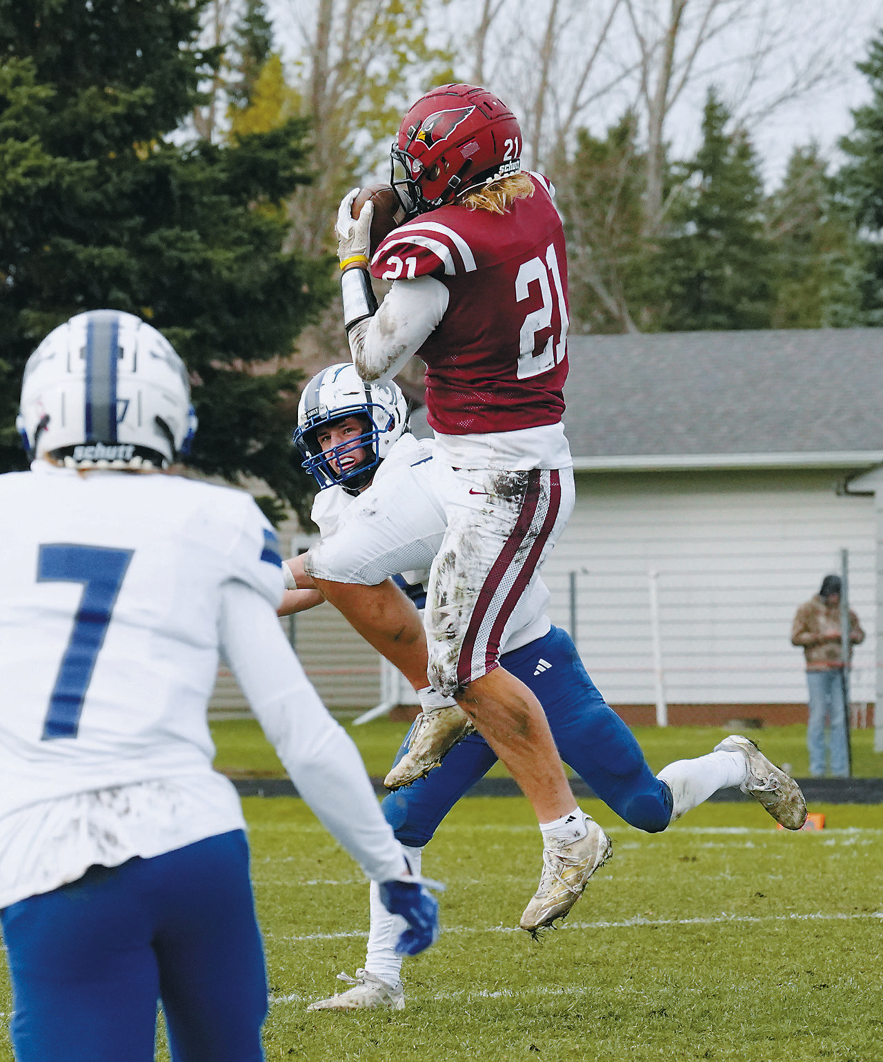 Theo Romfo leaps high and makes a great reception in the Cards' win over Hillsboro. Photo by Larry Stokke.