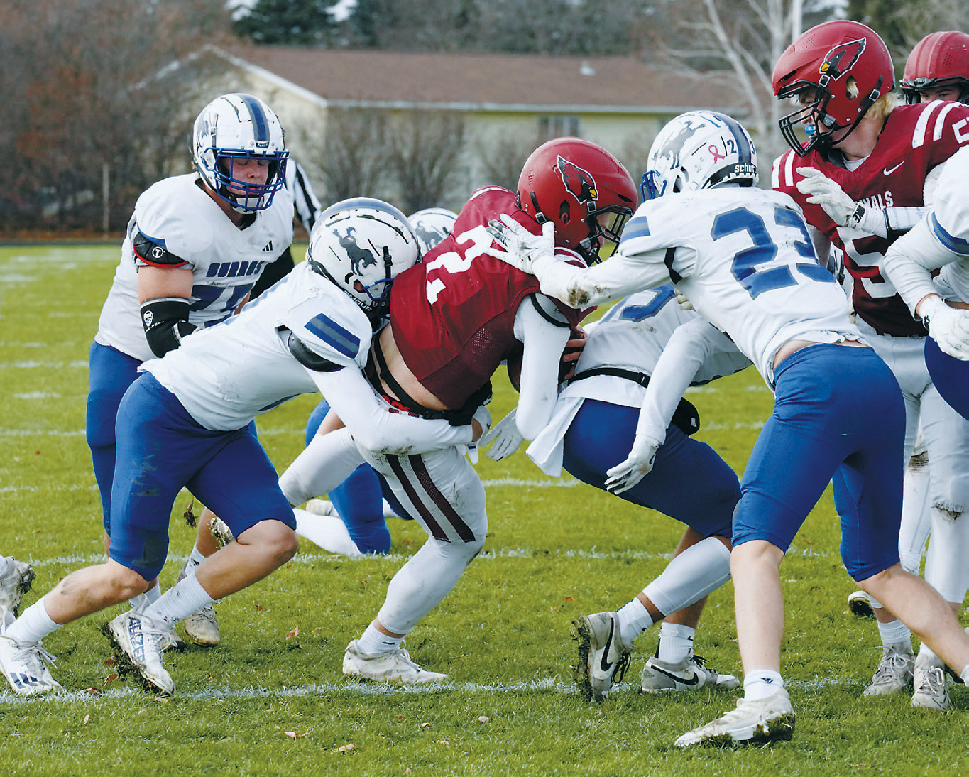 Jax Johnson drags a Burro across the goal line to add one more touchdown for a total of three for the game along with 156 rushing yards. Photo by Larry Stokke.