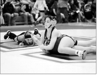 Tia Huguley made short work of her match by winning with a pin in 28 seconds. Photo by Larry Stokke