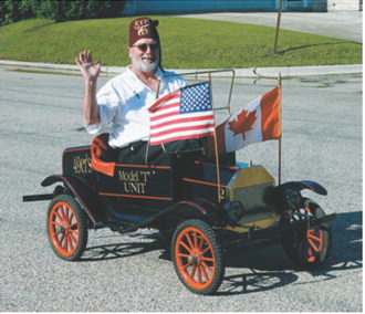 Rodney O’Brien of the Kem Shriner’s drives a miniature Model-T down main street during the first annual Pre-Blast-Bash. Photo by Larry Stokke