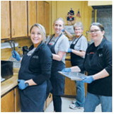 From left - right: Marissa Thorlakson, Kim Ford, Deb Stark, and Heather Lindsey hard at work in the kitchen. Photo by Gwen Zorn.