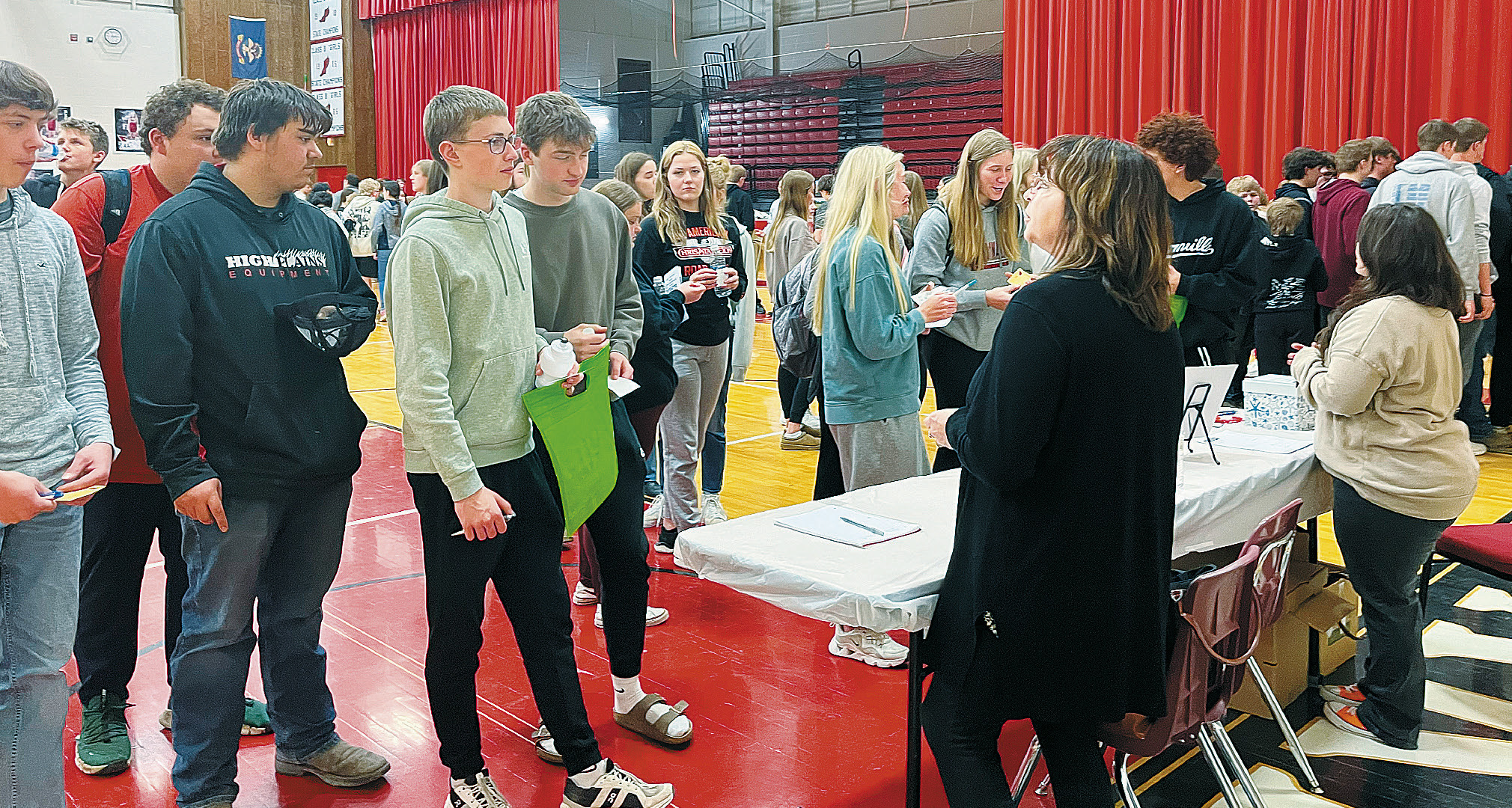Students gather around to discuss the job fair with Kari Phillips and Jessica Tull. Photo by Shannon Duerr.