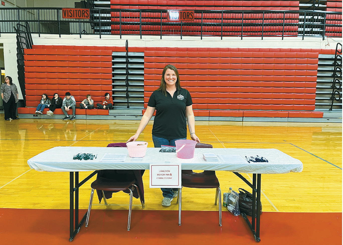 Vanessa Chaput mans the booth for Cobblestone Inn. Photo by Shannon Duerr.
