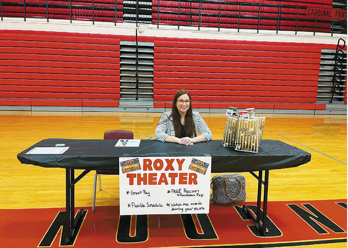 Julie Davis helps with the Roxy Theatre’s booth. Photo by Shannon Duerr.