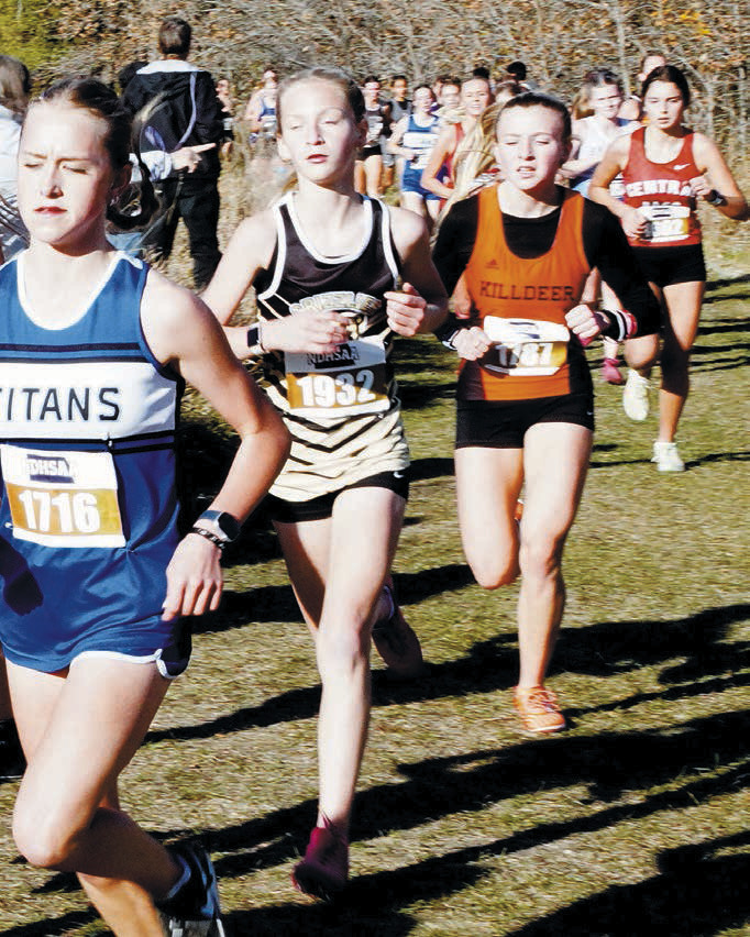 Maci Puppe [middle] placed 40th at the State Meet in Jamestown. Photo by Larry Stokke.