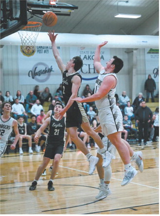 Guard Kaden Moore gets a quick release on a layup just ahead of the Chargers’ defense. Photo by Ashley Schafer